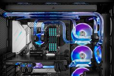 the inside of a computer case with blue and purple lights