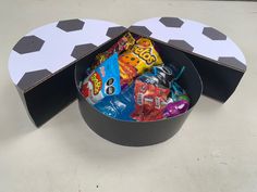 a black and white box filled with lots of candy