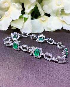 "A DREAM COMES TRUE! Gorgeous masterpiece! Ultimate ART-DECO Style Bracelet! Featuring 5 pieces of extra rare GLOWING BRIGHT GREEN COLOMBIAN Emerald weighting a total of 3.85 carats... and OVER 240 pieces of SPARKLING, top-grade, F/VS Diamonds (2.24 carats in total). SET IN ONE-OF-A-KIND 18K Solid White Gold, meticulously designed and handcrafted BRACELET! A true heirloom piece that can transcend beyond times and eras.... JUST FINISHED, HANDMADE BY OUR GOLDSMITHS! DAZZLING COLOMBIAN EMERALDS! Ex Silver Emerald Tennis Bracelet For Formal Occasions, Formal Silver Tennis Bracelet With Emeralds, Emerald White Gold Bracelet, Elegant Green Emerald Cut Diamond Bracelet, Formal Silver Emerald Tennis Bracelet, Elegant Silver Tennis Bracelet With Emeralds, Luxury Silver Tennis Bracelet With Emeralds, Classic Green Diamond Jubilee Bracelet, Elegant Silver Emerald Tennis Bracelet