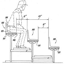 a man sitting on top of a chair next to a computer desk with the seat up