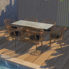 a table and chairs on a wooden deck next to a swimming pool in the sun