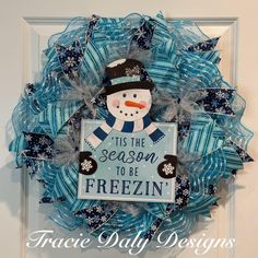 a snowman wreath with the words tis the season to be frozen on it