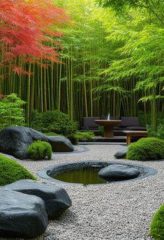 a garden with rocks and trees in the background