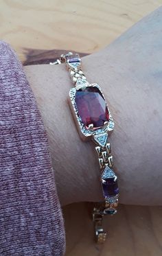 Absolutely Stunning 14k Yellow Gold, Red Tourmaline, Diamond, Amethyst, Blue Topaz Ladies Bracelet.. all sales are final no return So unusual unique design with Gemstones.. Some Pics ENLARGED to see details.  Bracelet is in very good Vintage Pre Owned Condition. Center is Natural Red Tourmaline have inclusions.. Custom made, One Of A Kind... Luxury Red Jewelry With Gemstone Accents, Luxury Gemstone Accented Bracelets For Formal Occasions, Garnet Multi-stone Jewelry For Gifts, Luxury Bracelets With Gemstone Accents For Formal Events, Luxury Bracelets With Gemstone Accents For Formal Occasions, Elegant Amethyst Bracelets With Gemstone Accents, Elegant Amethyst Bracelets For Anniversary, Elegant Amethyst Bracelet For Anniversary, Anniversary Bracelet With Gemstone Accents