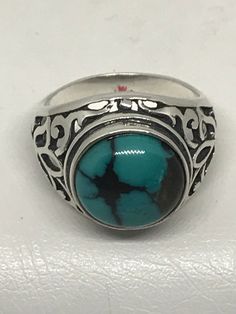 THIS IS A HAND CRAFTED "KINGMAN TURQUOISE 12x12mm ROUND GEMSTONE BACKED CABOCHON"  SET IN A STERLING SILVER .925 FILIGREE SETTING RING. THIS IS A BEAUTIFUL ONE OF A KIND  ITEM THAT WOULD LOOK SO GREAT WITH OTHER SIMILAR STYLE JEWELRY. WELL MADE HAND CRAFTED AND ONE OF A KIND RING THAT ONLY YOU WILL HAVE. IT IS SIZE **8** WEIGHS 35.0 cts.    #GSR-004 Elegant Sterling Silver Turquoise Cabochon Ring, Unique Sterling Silver Turquoise Cabochon Ring, Luxury Hallmarked Sterling Silver Turquoise Ring, Silver-setting Turquoise Cabochon Ring, Nickel-free Blue Turquoise Sterling Silver Ring, Sterling Silver Filigree, Kingman Turquoise, Silver Filigree, Custom Rings