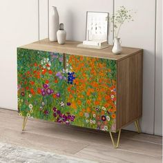 a cabinet with flowers painted on it