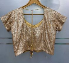 This is a custom stitched Rose Gold Sequins Fabric Blouse for Women and GirlsI make it exclusively for my customers by using designer fabrics.I will only make it after you confirm your required size details. Handling time: Don't worry, just tell me, I will process it accordingly and deliver on or before a delivery date you mention.Size: This is custom made as per your size. Any size possible be it for kids or plus sizes women.Post your order I will send you a measuremnts reference sheet using wh Fitted Gold Sequined Traditional Wear, Fitted Gold Traditional Wear With Sequins, Semi-stitched Gold Blouse Piece For Reception, Semi-stitched Gold Blouse For Wedding, Gold Blouse Piece With Sequins And Traditional Drape, Gold Sequined Blouse Piece For Reception, Traditional Gold Blouse Piece With Sequins, Gold Semi-stitched Blouse Piece For Reception, Gold Blouse With Mirror Work For Reception