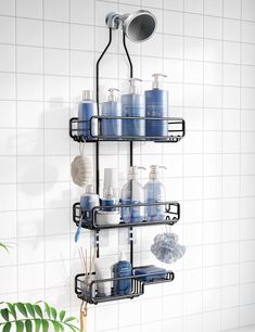 a shower shelf filled with lots of blue items