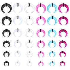 various colors of plastic ear gauges on white background