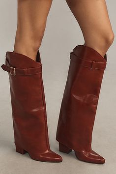 Exclusively at Anthropologie Leather upper, insole Rubber sole Pull-on styling Imported | x Anthropologie Buckle Foldover Boots by Matisse in Red, Women's, Size: 7, Leather/Rubber Faux Leather Heeled Boots With Buckle Closure, Brown Boots With Heel Loop For Fall, Brown Fall Boots With Heel Loop, Brown Leather Pointed Toe Wedge Boots, Leather Knee-high Boots With Buckle And Pointed Toe, Leather Pointed Toe Wedge Boots For Fall, Brown Pointed Toe Boots With Buckle Closure, Leather Knee-high Boots With Buckle And High Heel, Leather Wedge Boots With Buckle Closure And Round Toe