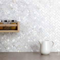 a kitchen counter with some jars on it