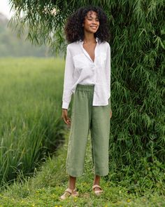 "Linen culotte pants BRUNY in Forest green with an elasticated waist are so comfy that you will want to live in them during the hot days. Made from lightweight linen they are very light and breezy. Makes a perfect match with breezy linen shirts and blouses.  Details: * Elasticated waist * 2 side seam pockets * Capri length (end above the ankle) * Light weight linen (approx. 135 gsm) * The model is wearing forest green pants in size XS (Paired with a white CALPE shirt in size XS) and is 5\"10\" (178 cm) tall. Model measurements: Bust: 31\"/79cm | Waist: 24\"/61cm | Hips: 33\"/84cm * The model is wearing black pants BRUNY in size XL (Paired with a black top CABRERA in size L/XL) and is 5'2\" (161cm) tall. Model measurements: Bust: 38'1\"/97cm | Waist: 29\"/74cm | Hips: 45\"/115cm * The model Affordable Green Cropped Leg Pants, Relaxed Green Summer Pants, Relaxed Green Pants For Summer, Green Linen Wide Leg Bottoms, Effortless Linen Bottoms For Day Out, Casual Green Linen Bottoms, Relaxed Fit Linen Wide Leg Pants For Day Out, Green Linen Straight Pants, Relaxed Green Wide-leg Pants