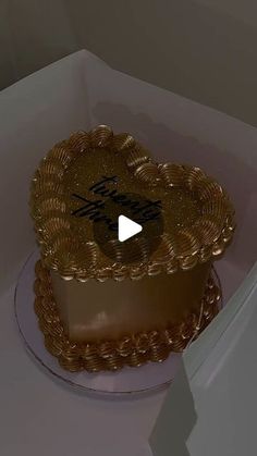 a heart shaped cake in a white box