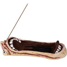 a fake tooth boat with a stick sticking out of it