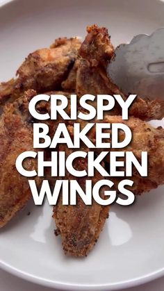 crispy baked chicken wings on a white plate with the words crispy baked chicken wings