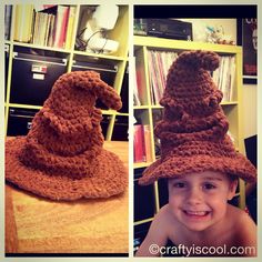 a little boy wearing a crocheted hat on top of a wooden table next to a book shelf