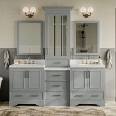 a large bathroom with two sinks and mirrors