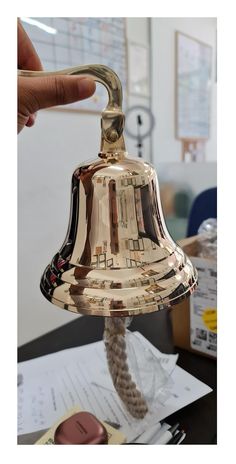 PRICES MAY VARY. This Handcrafted bell is made up of high quality solid brass for Clear distinct ringing tone. The bell stands 6 inches in diameter with thick rope cord. Heavy-duty Marine wall mounted design is perfect for engraving for a gift and great way to get student's attention. The pleasant chime sound is loud as well as clearly without noisy sound, which can be heard at a distance and truly a stunning piece of nautical décor. This vintage bell is ideal for Hotel, School, Dinner and Recep Dinner Bell Post, Garden Bells, Bar Reception, School Dinner, Hotel School, Bell Sound, Hanging Bell, Brass Bell, Dinner Bell