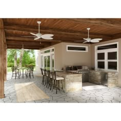 an outdoor kitchen and dining area with ceiling fans