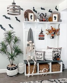 a living room filled with lots of halloween decorations and decor on top of a shelf