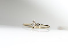 A gorgeous 14k yellow gold round band ring featuring a beautiful natural prong set marquise cut genuine diamond and a small accent diamond. Show a little love to yourself or someone special. This would be great on its own, or as an engagement ring. Diamond : This is a beautiful 1.75mm round genuine diamond. Gemstone : marquise cut genuine diamond measuring 5 x 3mm set in 14k yellow gold. Mark size at checkout. Let me know if you have any questions! Follow jenhoughdesigns on insta Jenhoughdesigns Delicate Marquise Diamond Ring In Yellow Gold, Dainty 14k Gold Marquise Cut Diamond Ring, Delicate Marquise Diamond Ring In 14k Gold, Delicate 14k Gold Marquise Diamond Ring, Dainty Marquise Diamond Ring In 14k Gold, Delicate Marquise Cut Yellow Gold Diamond Ring, Tiny Diamond Ring, Sturgeon Bay, Gold Nose Stud