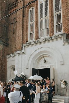 a group of people standing in front of a building