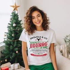 "This is a Christmas shirt from Griswold and company premium eggnog Chicago il Est 1989. It's a holiday tee with a retro feel that will make you look stylish and festive while celebrating the holidays with your loved ones. Welcome to the cozy corner of creativity! Our store is pleased to introduce our collection of quality t-shirts, sweatshirts, and hoodies that blend comfort, style, and self-expression. Embrace the warmth of our garments and let your unique personality shine through!  🎨 From trendy and chic to quirky and fun, our designs cater to all tastes and moods, making it easy to find the perfect match for your individuality. 🌟 Stand Out from the Crowd: Express yourself fearlessly! Whether you're an introvert looking to make a subtle statement or an extrovert who loves to turn hea Griswold Christmas, Dashing Through The Snow, Winter Shirts, Sweatshirts And Hoodies, Curated Design, Cozy Corner, Christmas Tees, Retro Christmas, Quality T Shirts