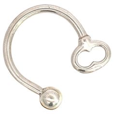 a metal hook with a heart on it