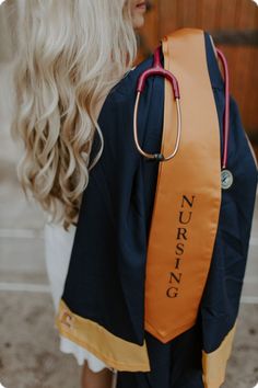 a woman with blonde hair and a stethoscope on her back wearing a nursing backpack