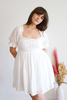 This Feona eyelet dress is the perfect summer addition to your wardrobe! Made with lightweight and breathable fabric, it features intricate eyelet details for a touch of elegance. The flowy design and comfortable fit will keep you feeling stylish and cool all day long. Feminine Midi-length Eyelet Dress, Feminine Midi Length Eyelet Dress, Chic Eyelet Midi Dress, Elegant Eyelet Dress For Summer, Elegant Summer Eyelet Dress, Feminine Eyelet Dresses For Daywear, Fitted Eyelet Midi Dress For Daywear, Summer Beach Eyelet Midi Dress, Chic Fitted Eyelet Midi Dress