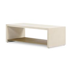 a white coffee table with an open shelf