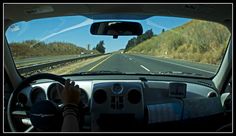 a view from the inside of a vehicle driving down a highway