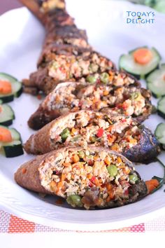 a white plate topped with meat and veggies