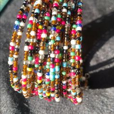 Seed Bead Bracelet Nwt Colored Beautiful. 7 3/4 Flat Lay Length Open End Adjustable Wrist #Boho # 80’s #Stylish #Vintagestyle #Seedbead Pink,Blue,Yellow,White,Black,Red Basic Color Is Rust Brown Thank You For Shopping Our Closet . (All Measurements Taken Laying Flat) And Are Approximately Smoke Free And Pet Free Home Any Offers All Reasonable Will Be Considered Please Contact Me I Will Be Happy To Assist You #Boho Spring Multicolor Beaded Necklace For Party, Spring Party Multicolor Beaded Necklaces, Multicolor Tiny Beads Bracelets For Party, Multicolor Beads For Summer Parties, Multicolor Beaded Chain Bracelets For Party, Spring Bohemian Multicolor Beads, Vintage Multicolor Beaded Bracelets For Beach, Party Multicolor Bracelets With Gold Beads, Vintage Multicolor Beaded Bracelets For Festival