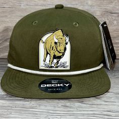 Our Pvc Patch Is A Waterproof, Rugged, And Clean Looking Design. You Can Bet That This Patch Will Look Vibrant For Years To Come. We Only Use The Highest Quality Products And Headwear. We Believe That Our Pvc Patches Beat Out Any Other Type Of Patch Offered On A Hat. Design: Colorado Wild Buffaloes Mascot Series Hat: Decky Color: Olive/ White Soft-Structured, Five-Panel, High-Profile 70/30 Cotton/Nylon Adjustable Plastic Snapback Slight Curve, Is Adjustable Either Way Hat Size: 7 - 7 3/4 Winter Street Wear, Pvc Patches, Nike Accessories, Hat Sizes, Black Nikes, Buffalo, Nike Men, Colorado, Accessories Hats