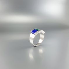 "Ring blue Lapis Lazuli and green Malachite with Sterling silver. Unique gift for her or him, friend, girlfriend, September and December birthstone, 9 year anniversary. A very special ring with a geometrical design of simplicity and modern elegance. The ring combines two stones and Sterling silver 925. The green Malachite is a perfect match to the deep blue Lapis Lazuli and the Sterling silver give it a modern touch. This beautiful ring is worked with the technique of inlay, which means the ston Blue Emerald Jewelry For May Birthstone, Modern Green Jewelry For Anniversary, Turquoise Lapis Lazuli Jewelry Gift, Turquoise Lapis Lazuli Jewelry For Gift, Blue Modernist Jewelry With Polished Finish, Modern Blue Gemstones For Anniversary, Modernist Blue Jewelry With Polished Finish, Modernist Gemstone Jewelry For Gifts, Unique Blue Emerald Jewelry