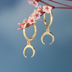 These cute dainty crescent moon hoop earrings are made of solid 925 sterling silver and 18k gold plate, features cute dangle drop crescent moon on hoop closures.Hoop earrings ear huggies are comfortable to wear all the time.Add these crescent moon hoop earrings to your everyday fine jewelry collection or as gift for your love one. Jewelry Care: See more information about how to care for your jewelry here. Shipping Policy: Orders will be shipped within 1-3 business days. Economy shipping will tak Ear Huggies, Earrings Ear, For Your Love, Fine Jewelry Collection, Crescent Moon, Solid 925 Sterling Silver, Jewelry Care, Crescent, Gold Earrings