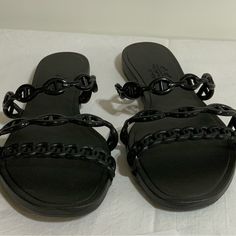 Size 40 But Fits Like Size 8. Like New, Never Worn Black Slip-on Synthetic Jelly Sandals, Casual Black Jelly Sandals With Flat Heel, Black Slip-on Jelly Sandals For The Beach, Black Flat Heel Jelly Sandals For Beach, Black Flat Jelly Sandals For Beach, Black Open Toe Jelly Sandals, Black Flat Jelly Sandals For Party, Black Synthetic Jelly Sandals For The Beach, Black Jelly Sandals For Beach