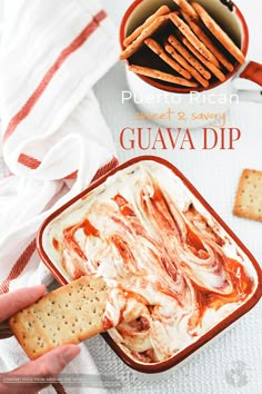 a person dipping crackers into a bowl of guava dip