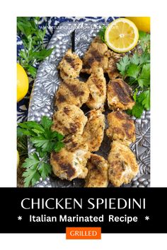 chicken marinated recipe on a platter with lemons and parmesan garnish