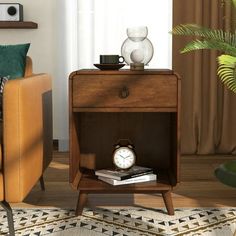 a small wooden table with a clock on it in a living room next to a chair