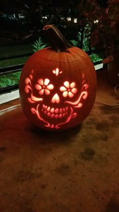 a pumpkin carved to look like a skull