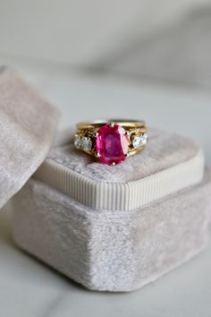 One Retro Ruby and Diamond 18k Yellow Gold Ring. Featuring one cushion cut ruby weighing approximately 2.40 carats. Accented by four round brilliant cut diamonds with a total weight of approximately 0.40 carat, graded H-I color VS clarity. Crafted in 18 karat yellow gold. Circa 1940. The ring is a size 4 3/4 and cannot be resized.About this Item: Step into the mystique of the past with this captivating vintage ruby and diamond ring. Circa 1940, this exquisite piece of jewelry features a cushion Engagement Ring Quiz, Colored Stone Engagement Rings, 5 Carat Ring, Yellow Gold Cocktail Ring, Halo Style Engagement Rings, Unique Rings Vintage, Ruby And Diamond Ring, Platinum Diamond Engagement Rings, Colored Engagement Rings