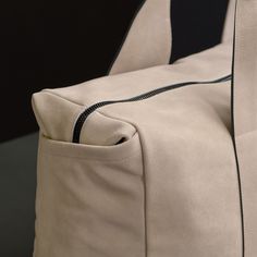 Our modern and sleek duffle bag is made from Italian calf suede with contrast hand glazed edges and is functionally designed, becoming the essential every day or travel ready bag. Additional Information:• Italian Calf Suede • Fully lined with internal zippered pocket• Side Welt Pockets• Length: 21.8", Width: 8.6" Height: 15.75"• Top Handle Drop: 9"• Removable Grosgrain adjustable shoulder strap Modern Suede Bag For Everyday Use, Modern Shoulder Bag With Suede Lining, Suede Travel Bag With Leather Trim, Travel Suede Bag With Leather Trim, Modern Leather Weekender Bag With Leather Trim, Modern Suede Shoulder Bag For Travel, Modern Suede Satchel For Travel, Suede Satchel With Suede Lining For Travel, Modern Weekender Bag With Leather Handles