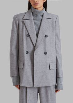 Color: Grey Midweight woven suiting fabric Relaxed silhouette Notch lapel Slightly padded shoulders Button cuffs Front flap pockets Vented back Front button closure Lined 56% Polyester 24% Rayon 18% Wool 2% Spandex Dry Clean Imported Suiting Fabric, Frankie Shop, Flap Pocket, Dry Clean, Spandex, Blazer, Wool, Grey, Fabric