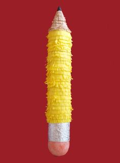 a pencil made out of yellow and white paper