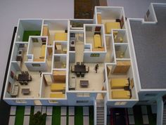 an overhead view of a model house with furniture