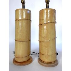 two wooden lamps sitting next to each other