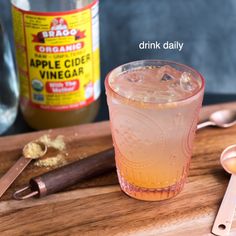 an apple cider vinegar cocktail on a cutting board