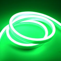 two white neon lights on a green surface